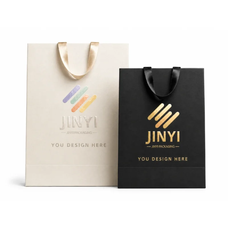 Custom gift bags in white and black paper with gold foil hot stamping and ribbon handles — JINYI