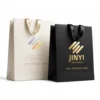 Custom gift bags in white and black kraft paper with ribbon handles — JINYI