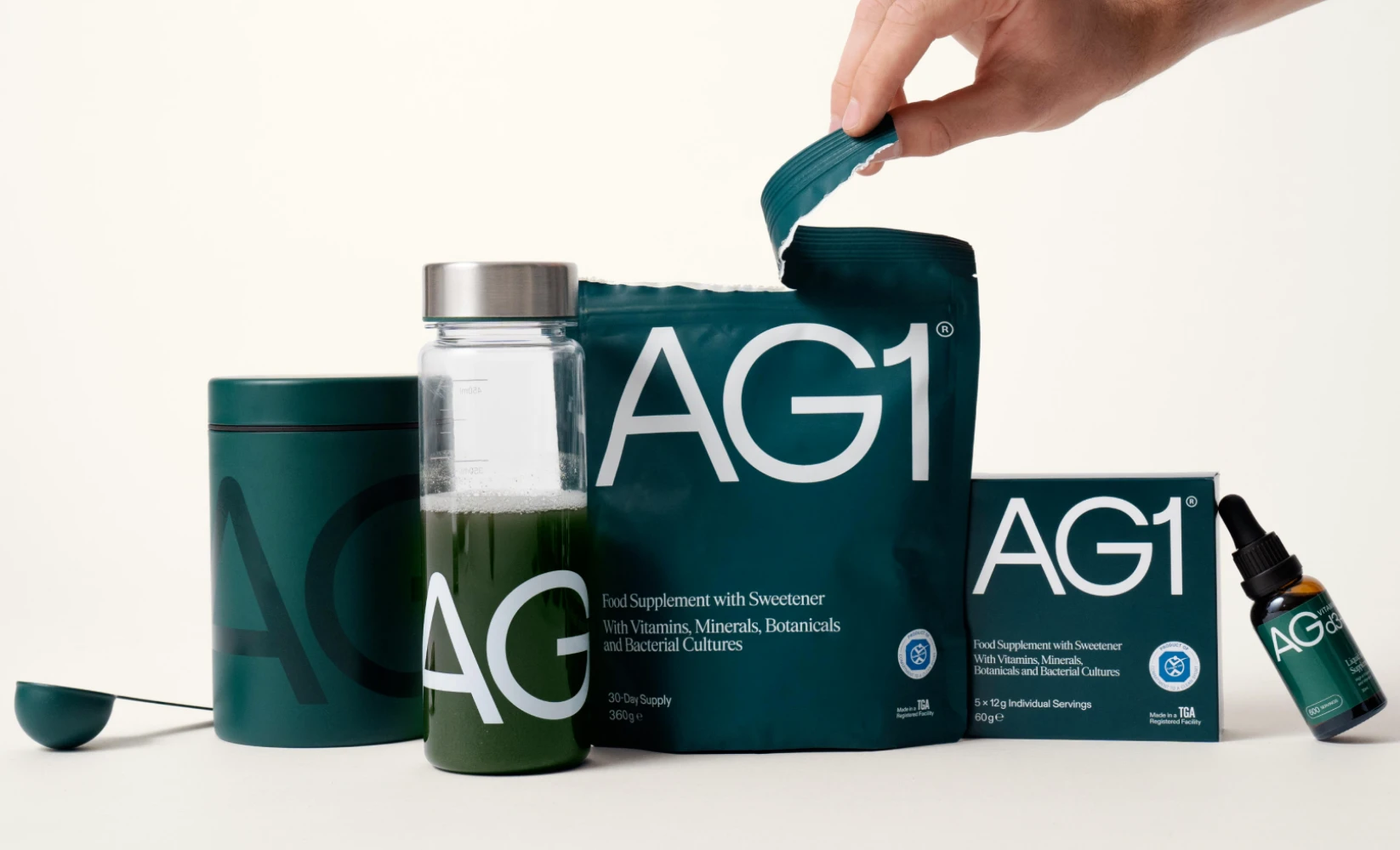 AG1 Athletic Greens complete supplement packaging range — stand-up pouch and canister showing matte finish and brand design