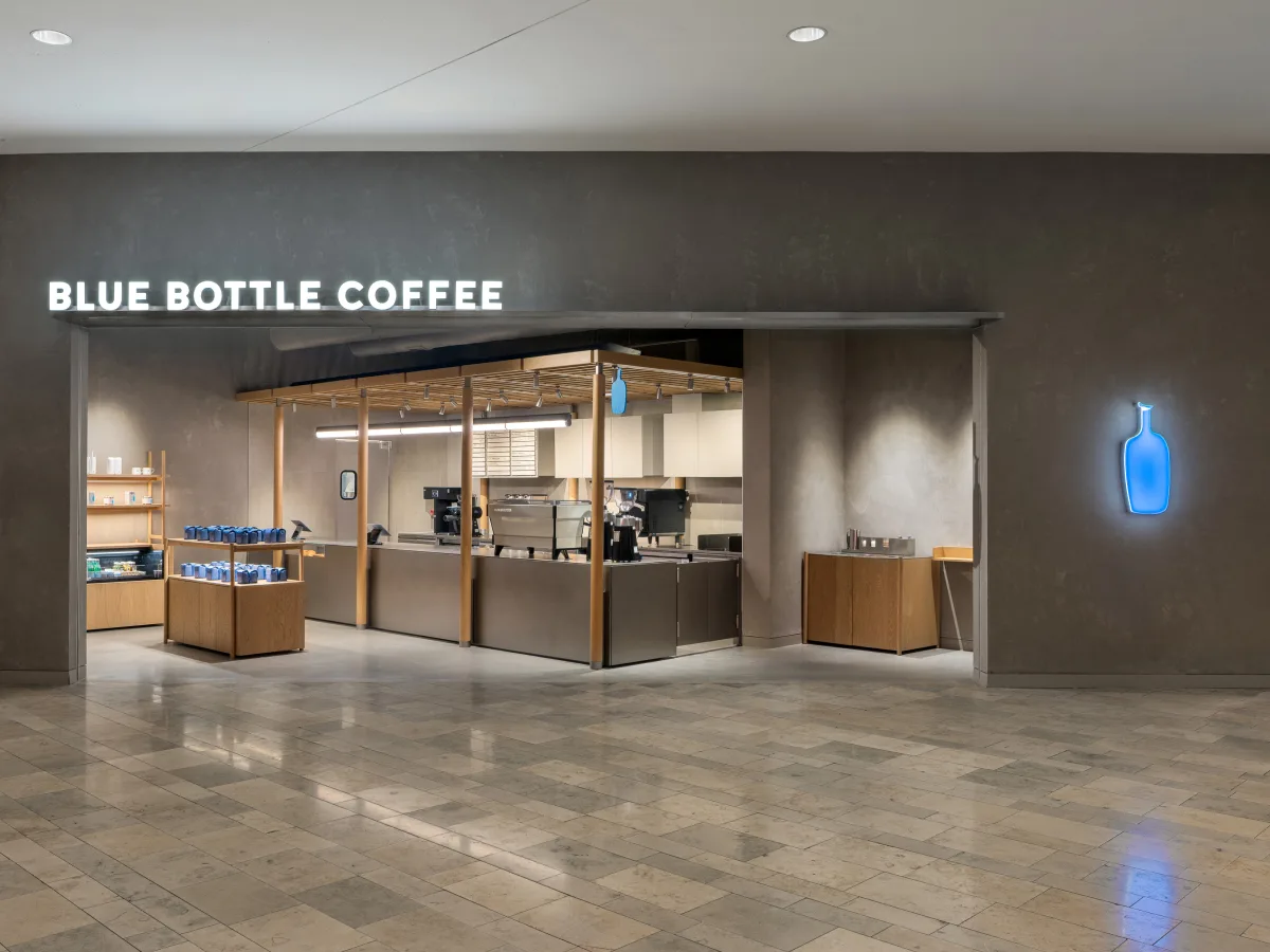 Blue Bottle Coffee café interior retail store — minimalist brand environment reflecting the same design restraint seen in their flexible packaging