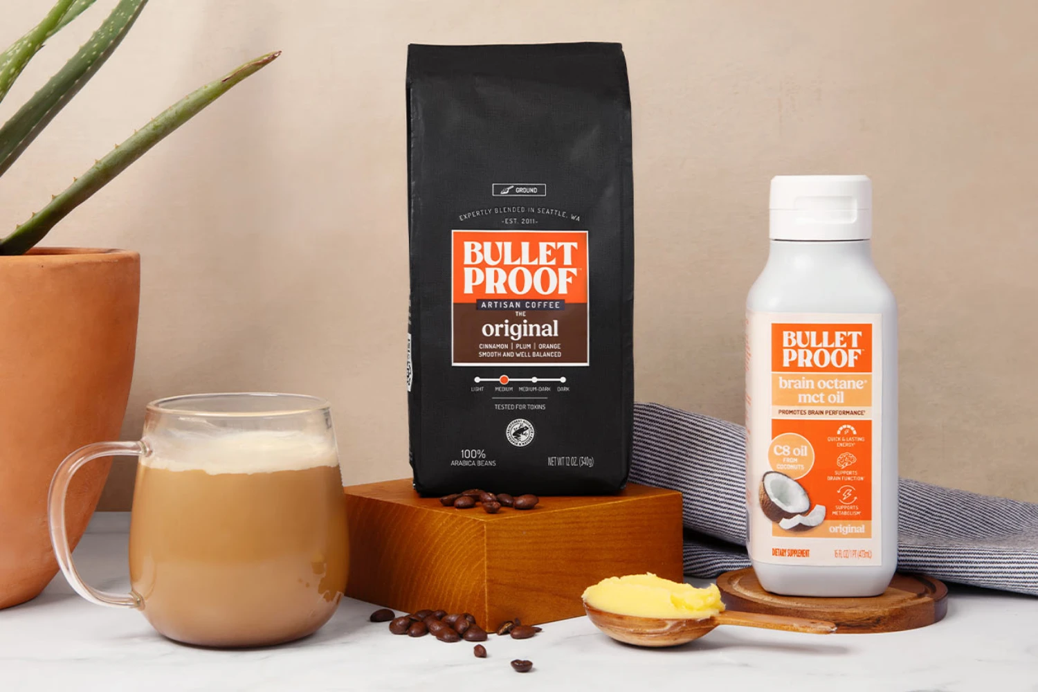 Bulletproof Coffee retail packaging — black matte stand-up pouch with brand artwork and product lifestyle display