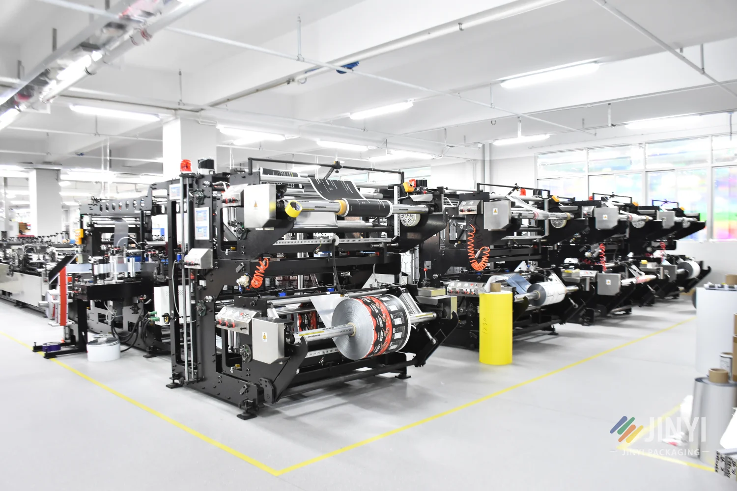 JINYI bag making machine producing custom stand-up pouches — forming sealing and cutting flexible packaging on automated production line