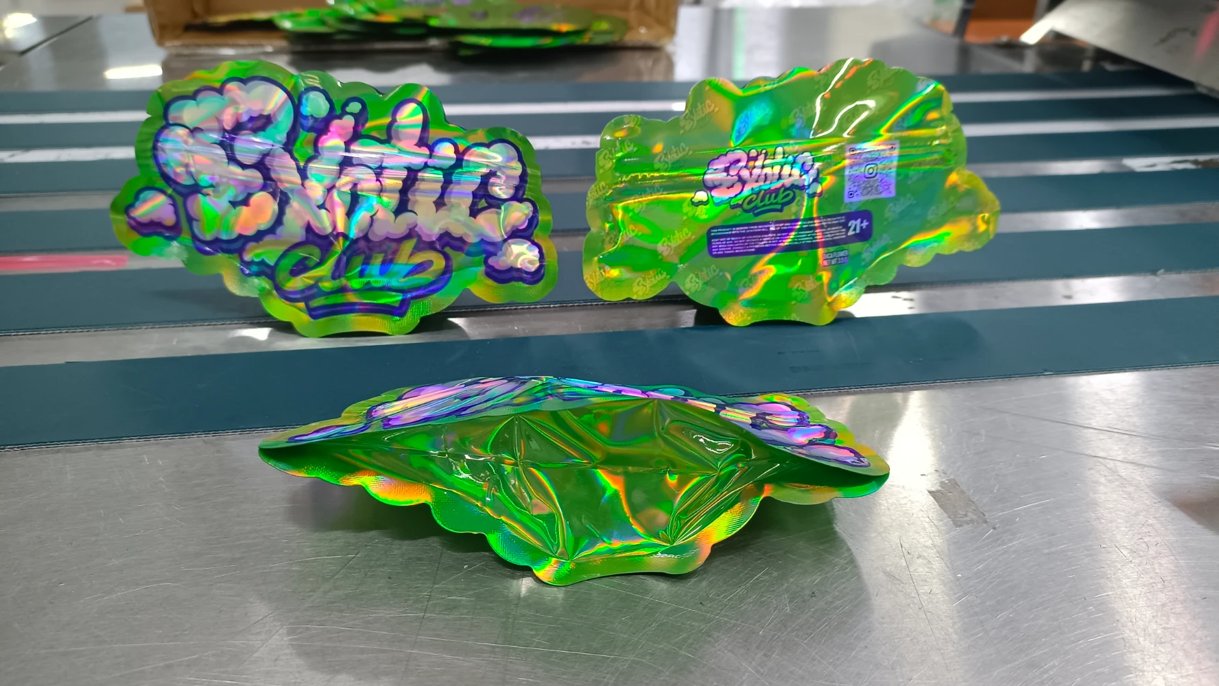 Custom die-cut cannabis mylar bag in leaf shape — OEM weed packaging factory direct with holographic finish