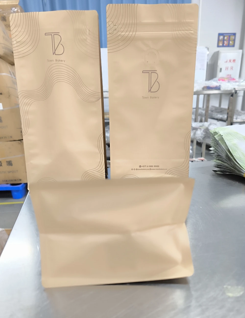 custom flat bottom coffee bags produced at JINYI factory — ready for quality inspection