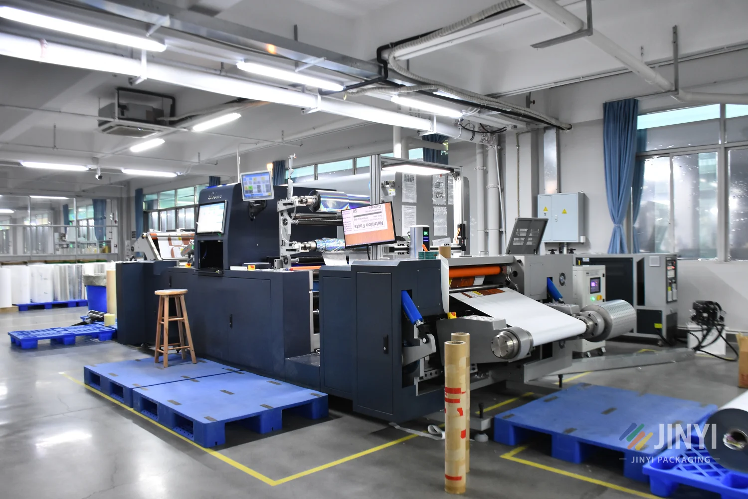 JINYI hot stamping machine for specialty finish flexible packaging — foil stamping on custom stand-up pouches and printed products