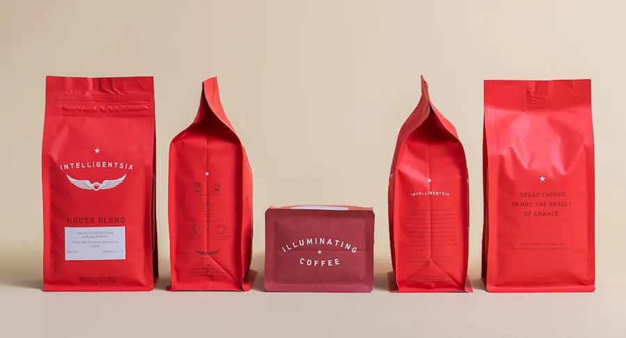 Intelligentsia Coffee bag range — multiple sizes showing flat-bottom and stand-up pouch formats in signature red packaging