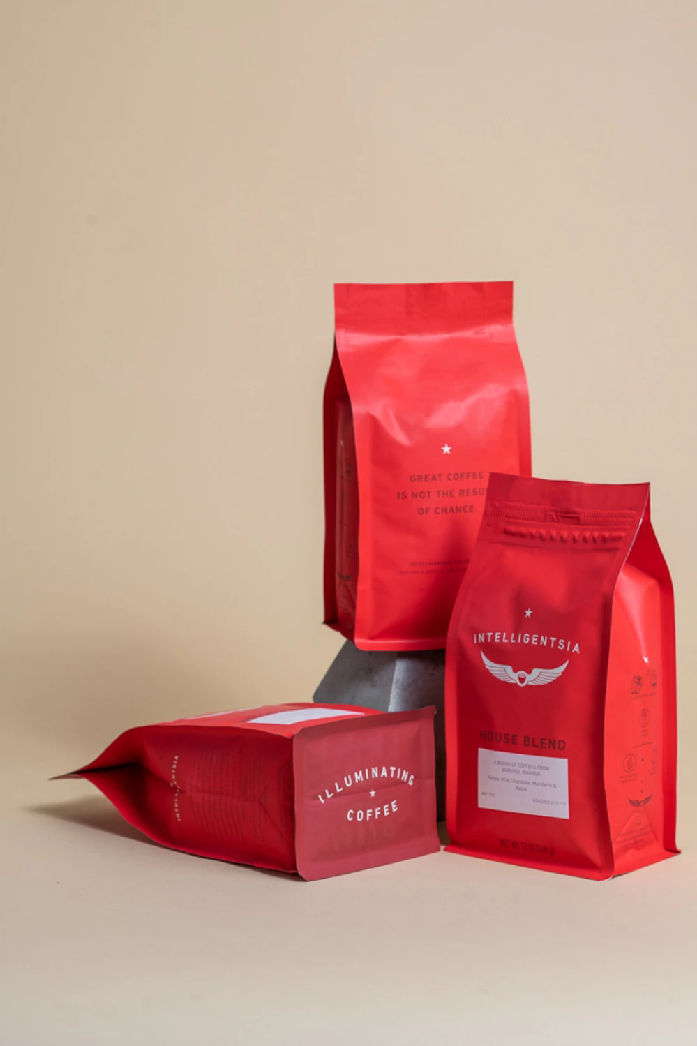 Intelligentsia Coffee flat-bottom bags in two sizes — eight-side seal and stand-up pouch formats in signature red