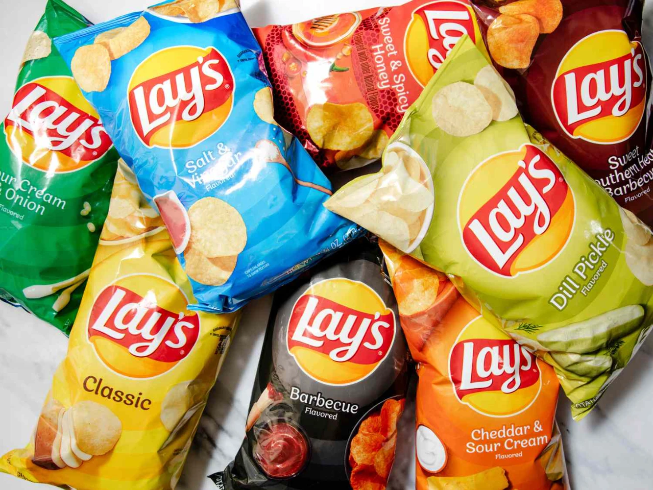 Multiple Lay's potato chip flavors in pillow bag packaging laid flat