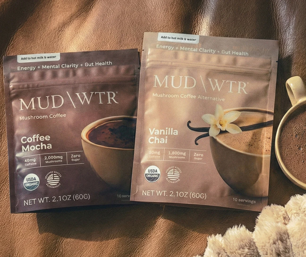 MUD\WTR stand-up pouch packaging — Coffee Mocha and Vanilla Chai flexible bag formats with color-block design