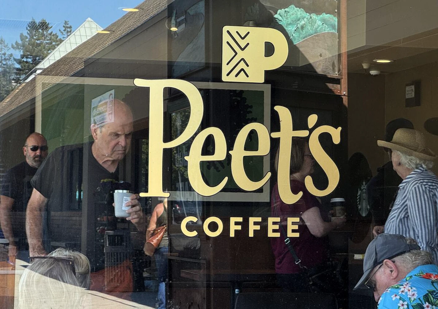 Peet's Coffee brand store exterior — the original specialty coffee roaster founded in Berkeley 1966 that inspired Starbucks founders