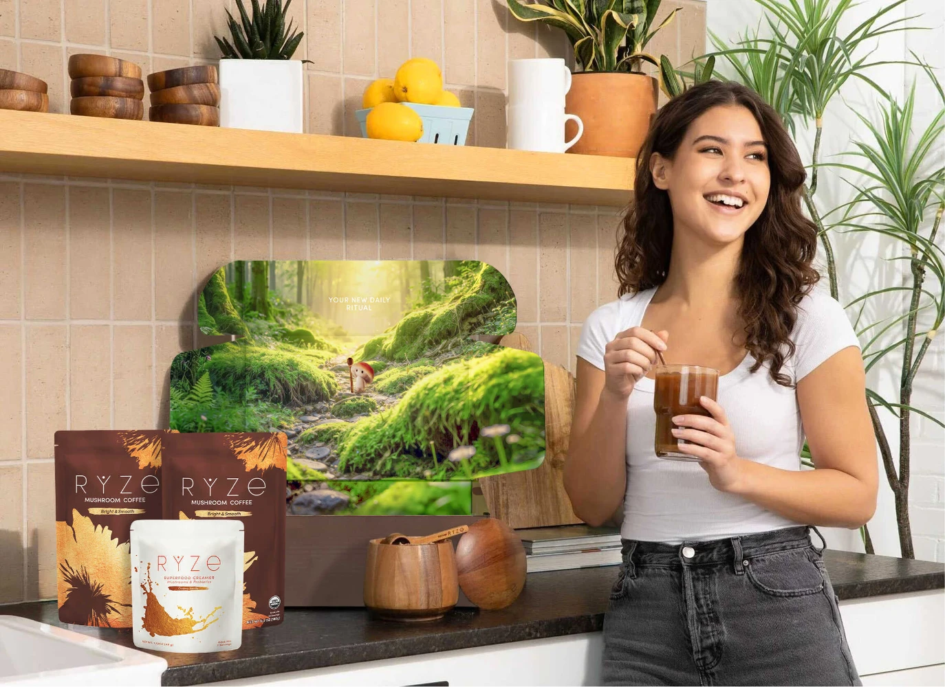 RYZE Mushroom Coffee lifestyle brand ambassador holding coffee in kitchen — earth-tone stand-up pouches visible on counter showing DTC wellness brand packaging in consumer content setting