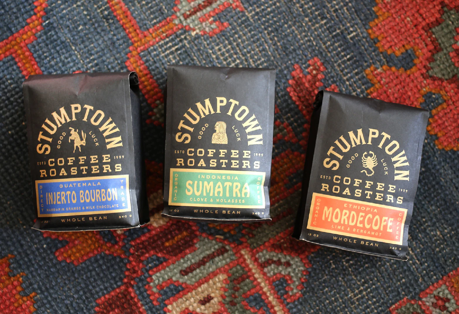 Stumptown Coffee dark series packaging — Weirdo Bourbon, Sumatra and Mordecope side gusset bags with color-coded design