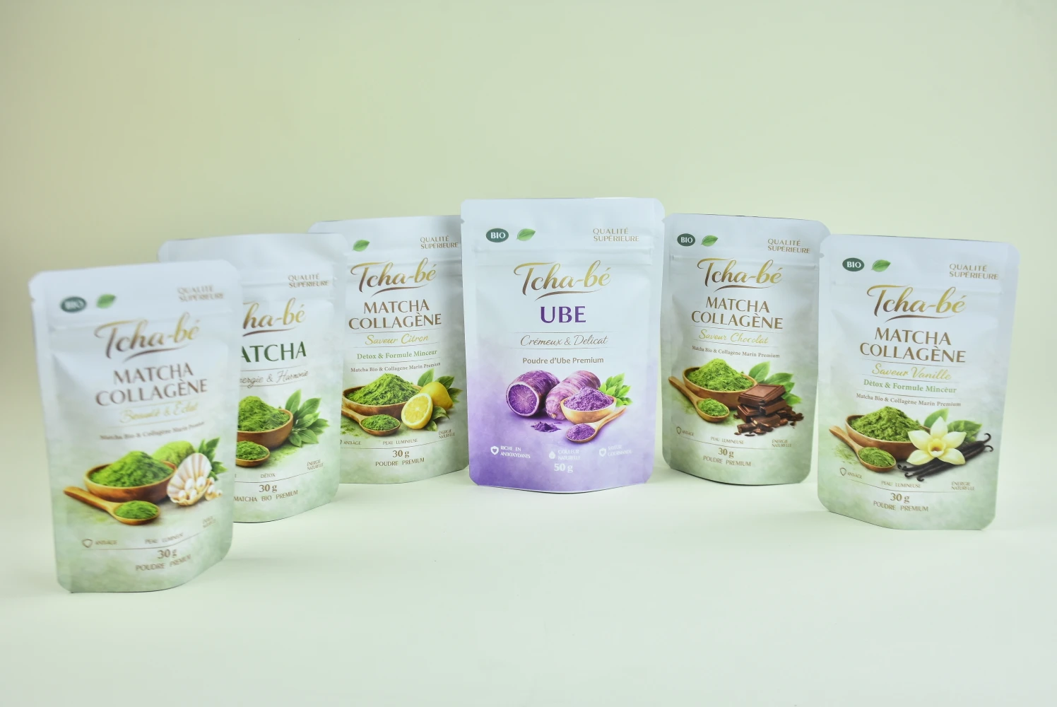 Tcha-bé full supplement powder range including UBE and matcha variants — custom multi-SKU packaging produced by JINYI