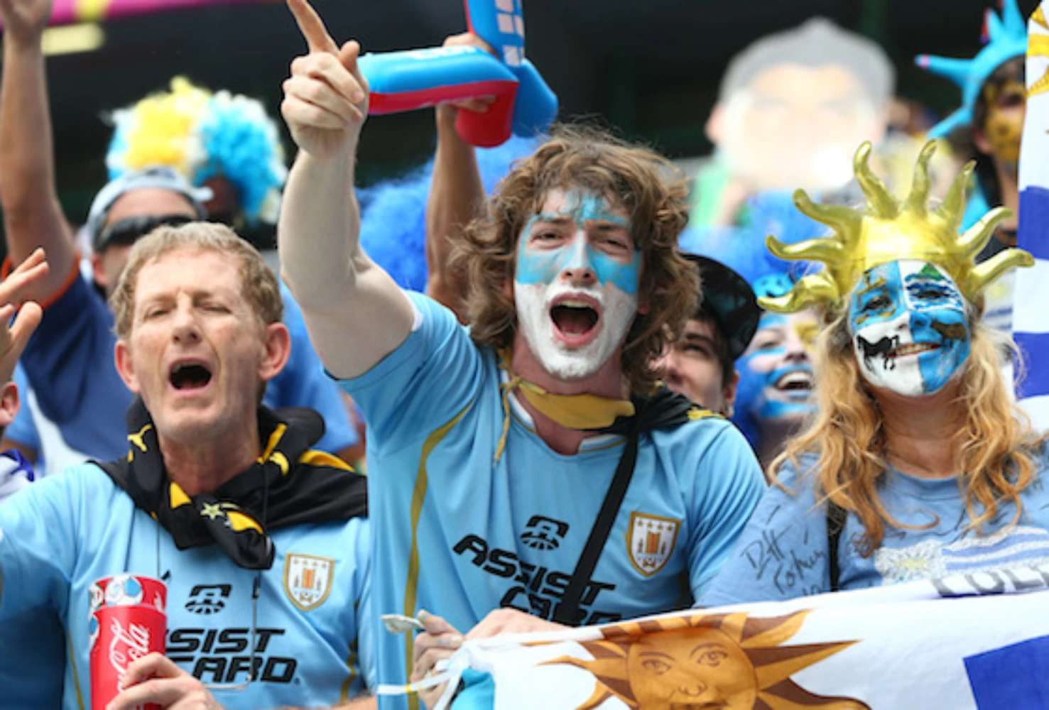 FIFA World Cup 2026 soccer fans celebrating in stadium — passionate crowd with face paint and team colors