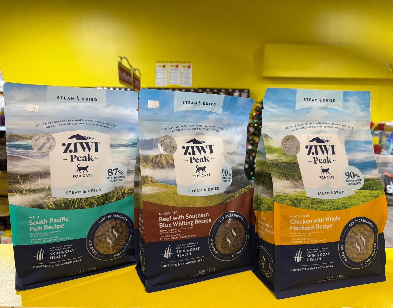 ZIWI Peak dog food packaging range — multiple recipe flat-bottom pouches showing SKU color coding system