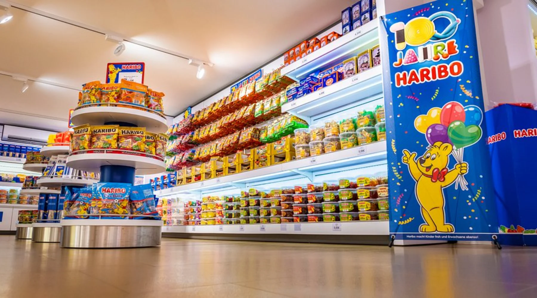 Haribo flexible packaging bags displayed on a supermarket retail shelf