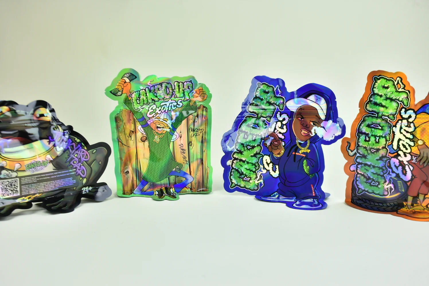 Custom holographic die-cut shaped pouches multi-character range — produced factory-direct by JINYI