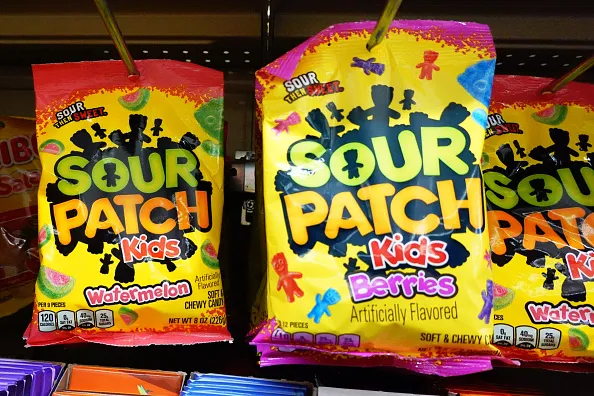 Sour Patch Kids Watermelon and Berries flavor bags displayed on a retail store shelf
