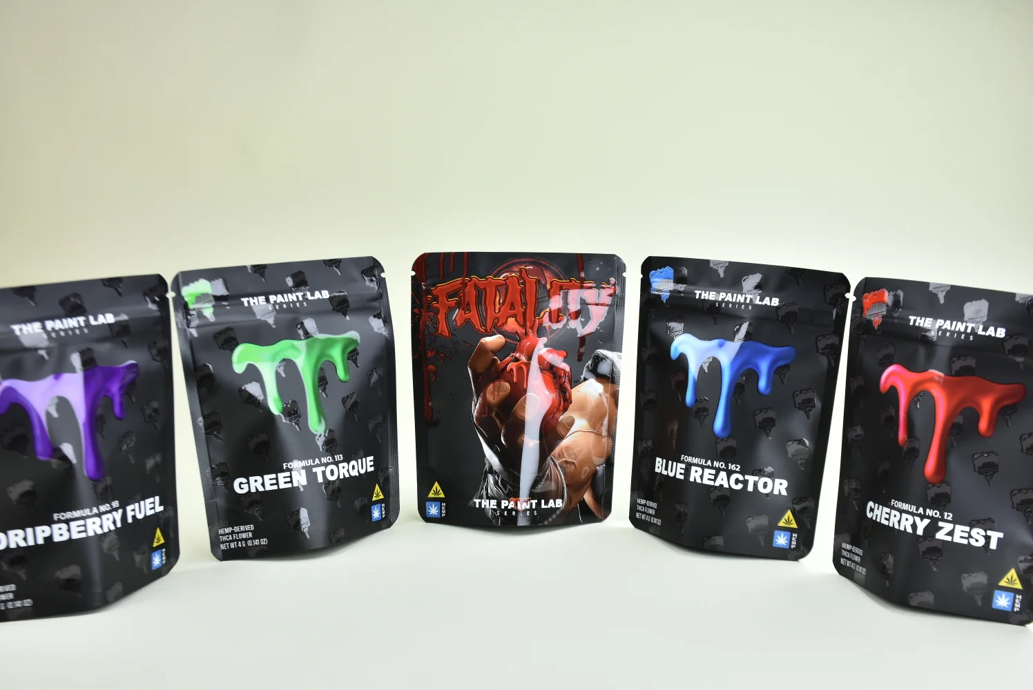 The Paint Lab custom stand-up pouches multi-variant display — matte black finish produced by JINYI