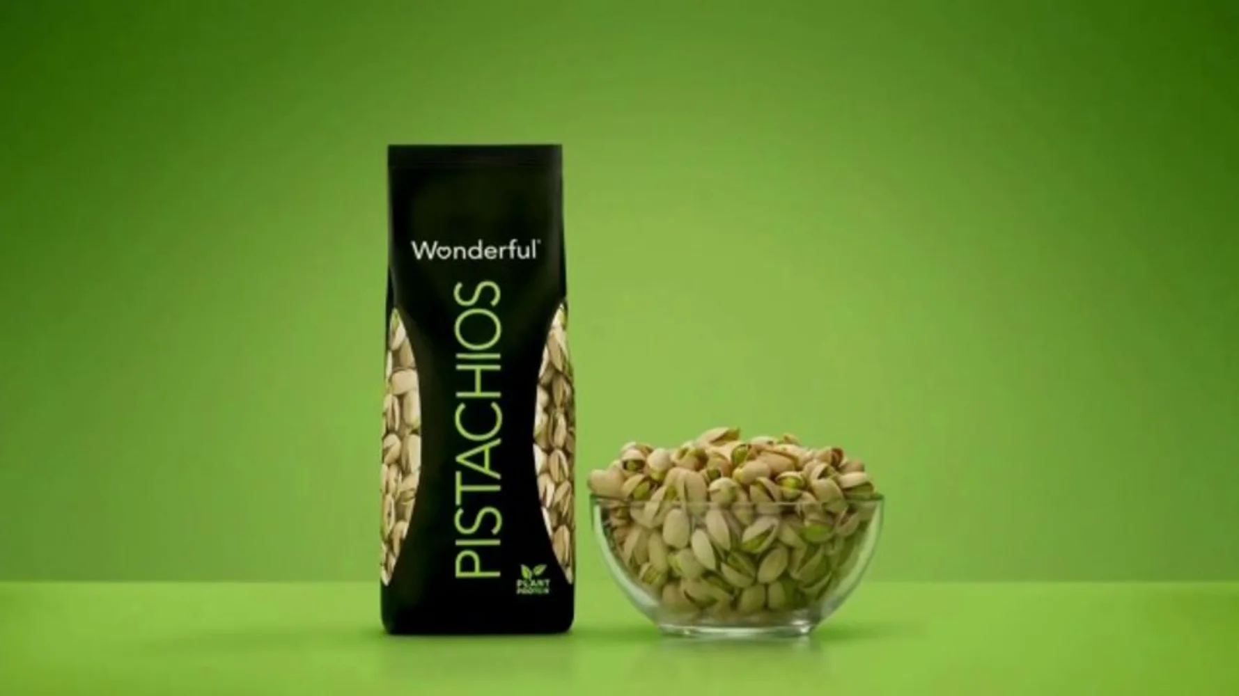 Wonderful Pistachios No Shells stand-up pouch displayed on dark green background