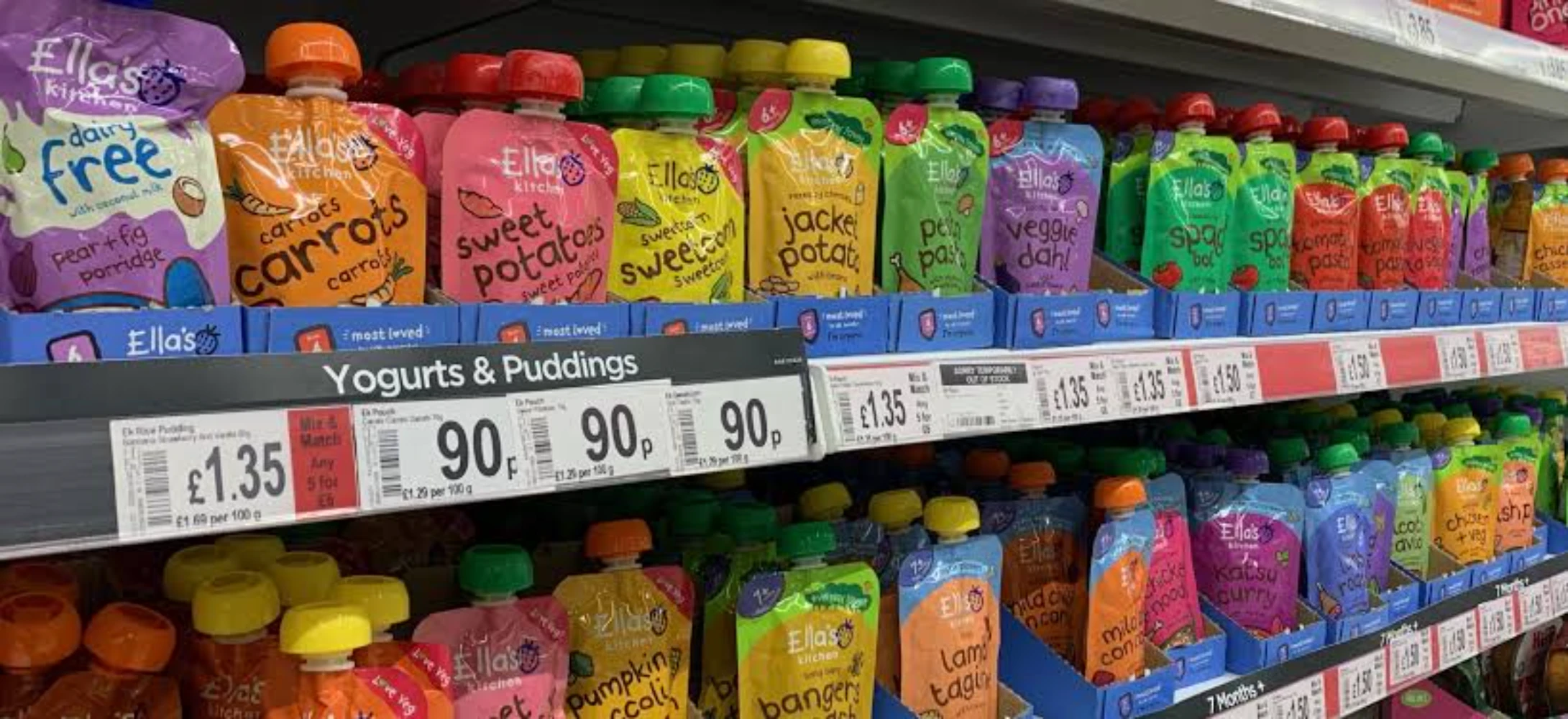 Ella’s Kitchen baby food spout pouches displayed in rows on a supermarket shelf